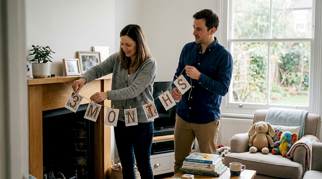 Parents hanging baby milestone banner at home